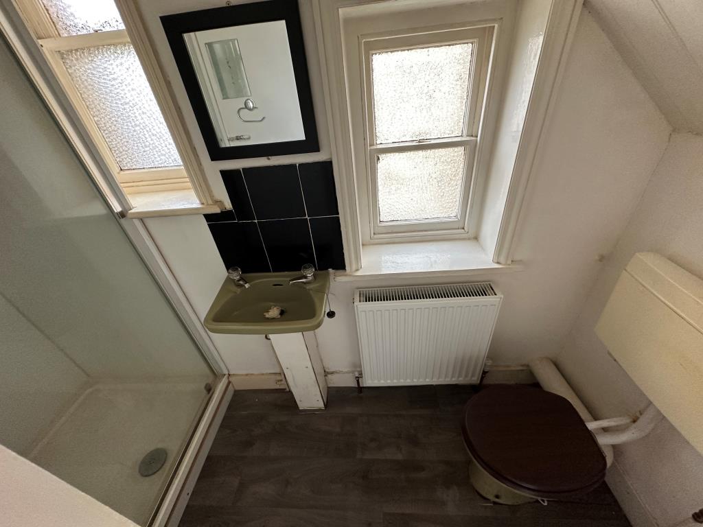 Lot: 81 - TWO-BEDROOM SELF-CONTAINED FLAT FOR IMPROVEMENT - Bathroom with shower, basin and WC